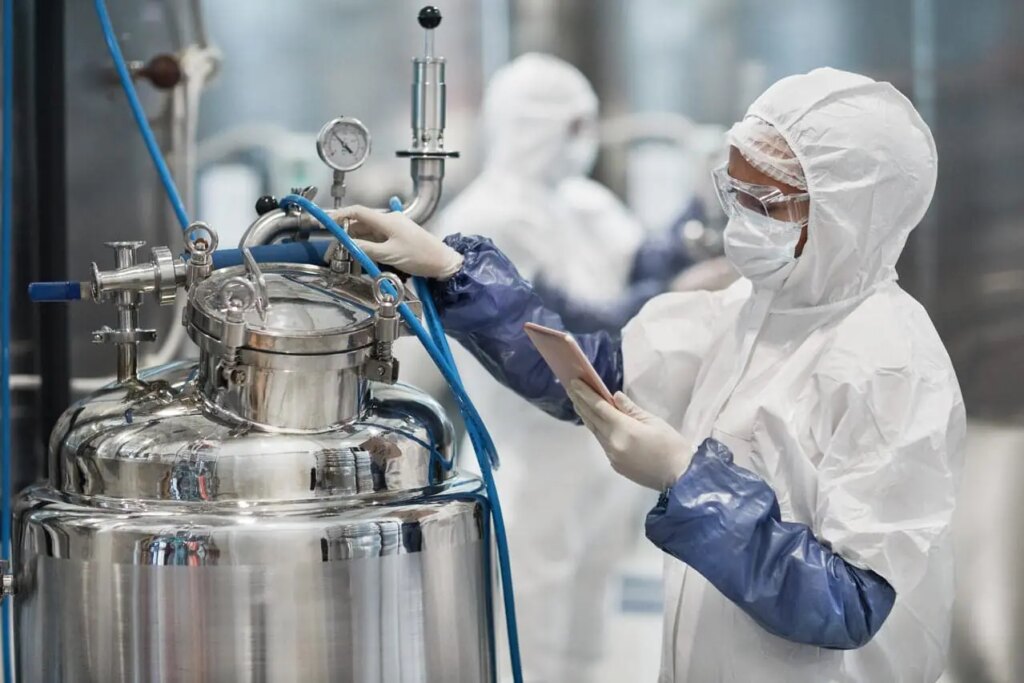 woman operating pharmaceutical production
